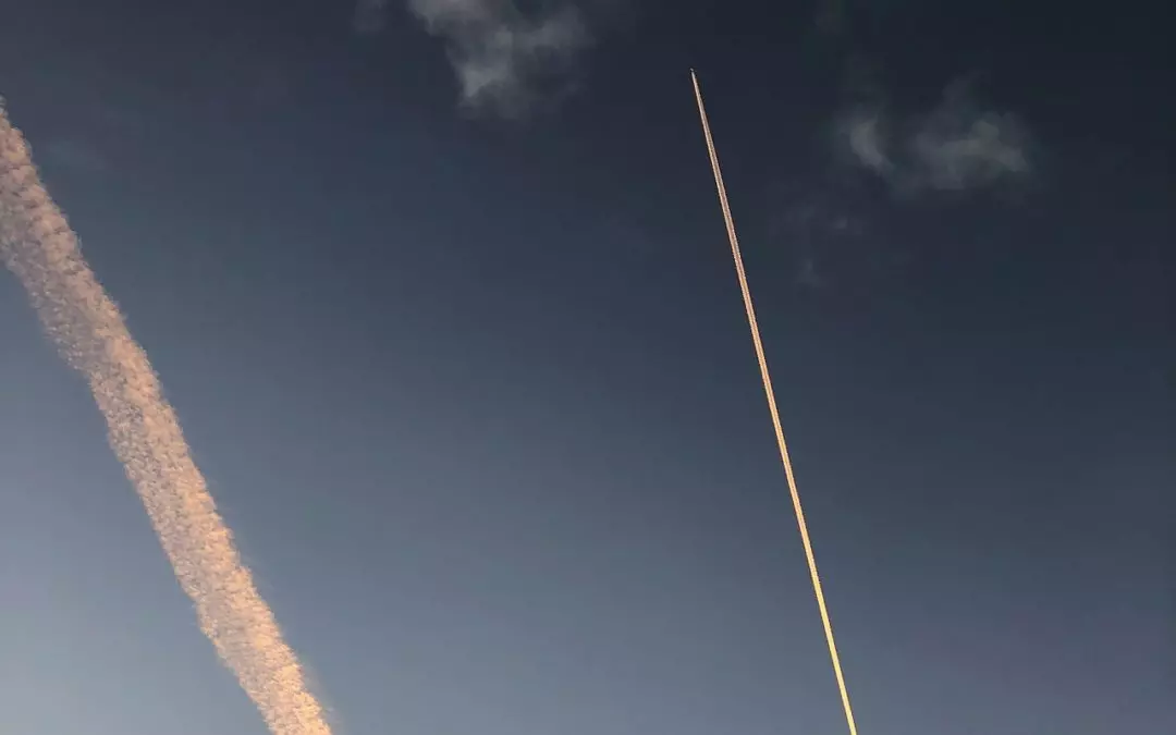Contrails of an airplane up in the sky