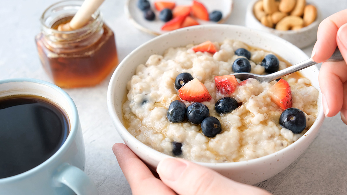 Girl serve porridge