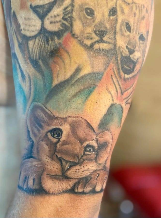 татуировка с льваи