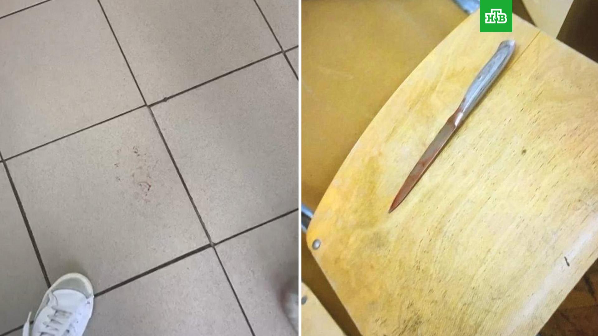 Сколоченный из неотесанных досок стол изрезанный ножами покрыли купленной