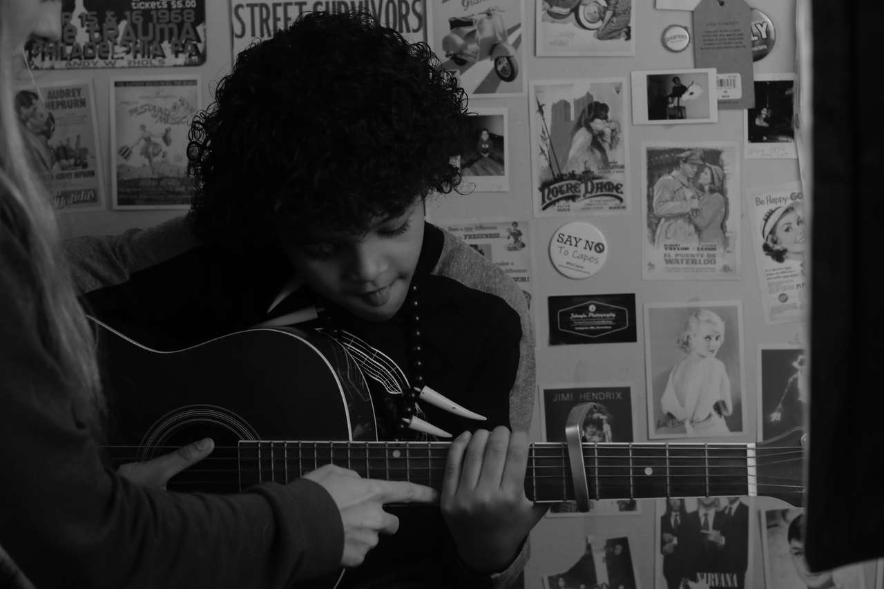 Семён Якубов актер. Boy playing the Guitar 90s Polaroid photo.