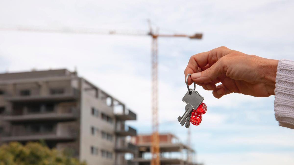 hand-holding-keys-outdoors