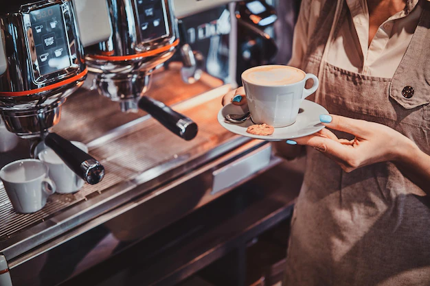 Process of coffee making using brand new coffee machine at cafe by expirienced barista.