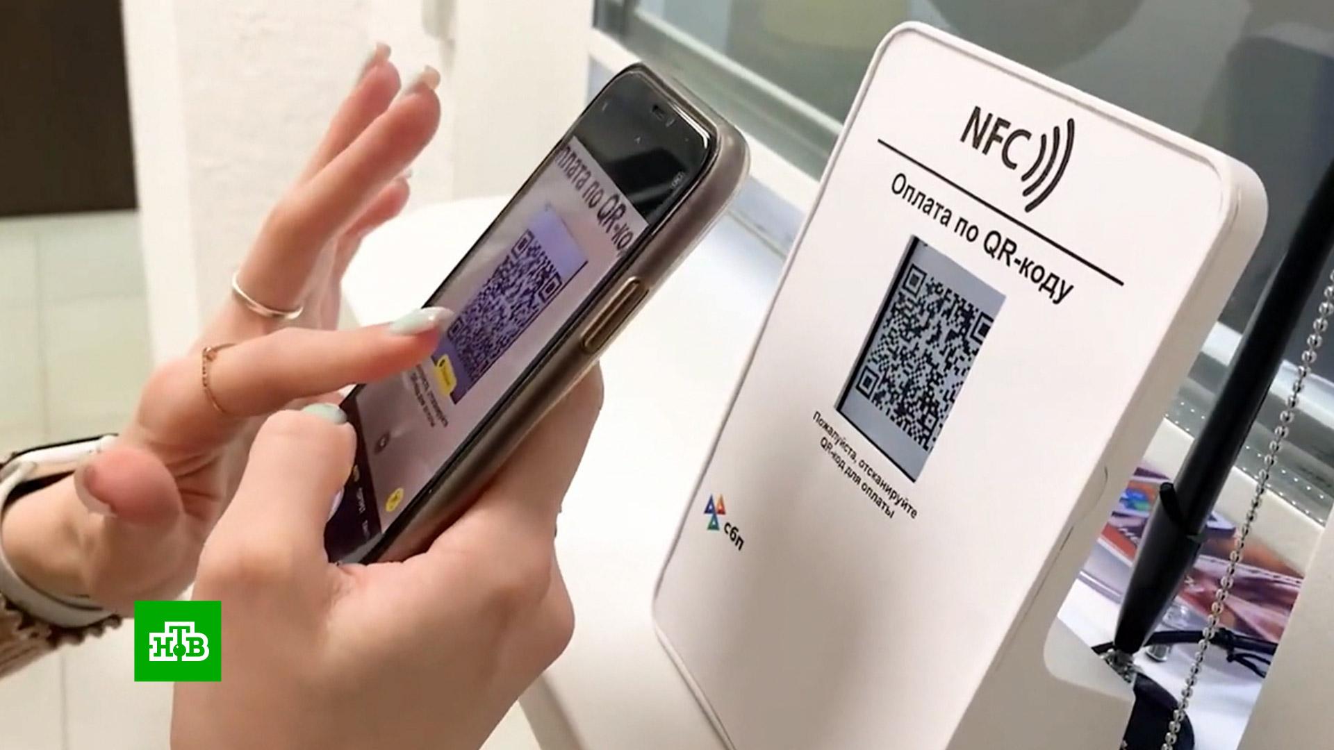 Сбпэй через nfc. Сбпэй на айфон NFC. Терминал сбпэй. Фото расплачиваемся эпл Пэй Грузия. Как платить айфоном.