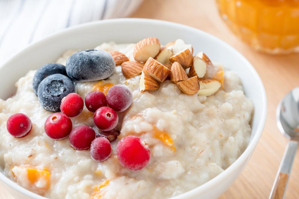 Girl serve porridge