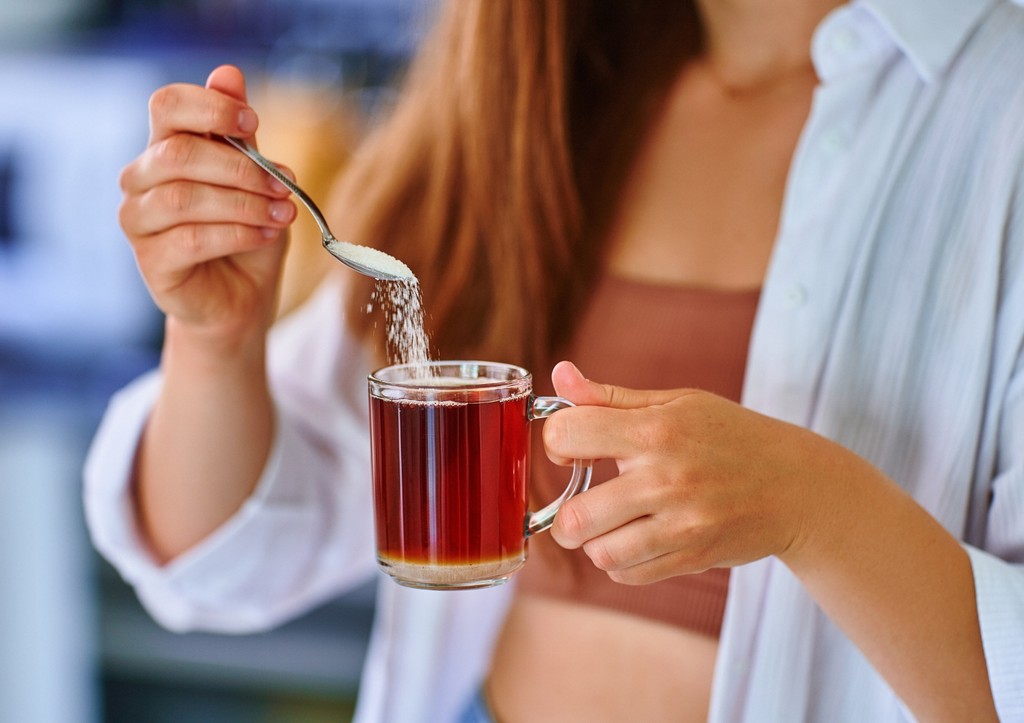 She puts sugar in her tea