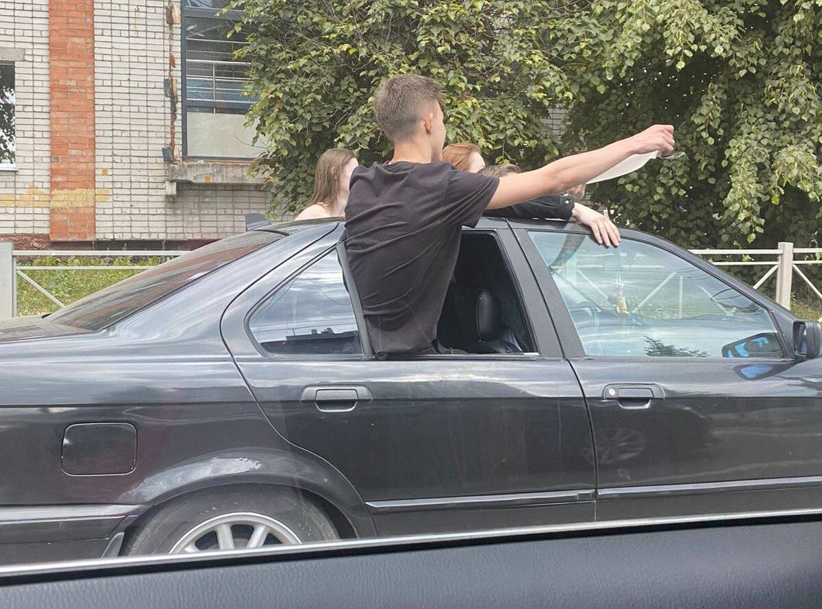 Leaning out of car